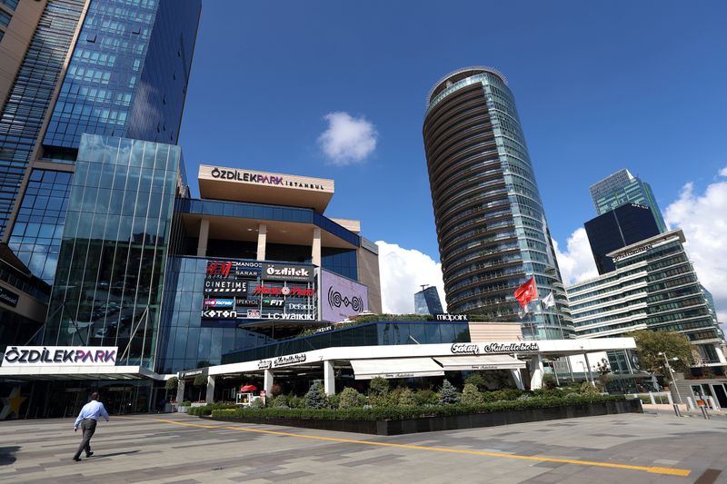 &copy; Reuters. FILE PHOTO: A man walks towards the entrance of OzdilekPark Shopping Center in the business and financial district of Levent, in Istanbul, Turkey September 8, 2020. REUTERS/Murad Sezer