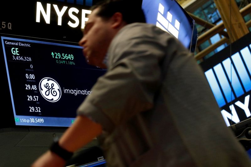 &copy; Reuters.  A trader passes by the post where General Electric is traded on the floor of the New York Stock Exchange (NYSE) in New York City, U.S. October 31, 2016.  REUTERS/Brendan McDermid/File Photo