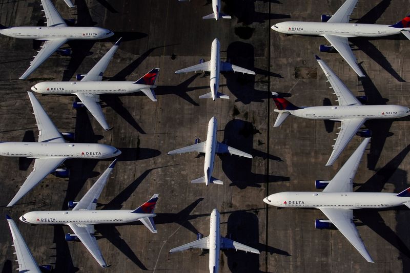 © Reuters. FILE PHOTO: Delta Air Lines passenger planes are seen parked due to flight reductions made to slow the spread of coronavirus disease (COVID-19), at Birmingham-Shuttlesworth International Airport in Birmingham, Alabama, U.S. March 25, 2020.  REUTERS/Elijah Nouvelage//File Photo