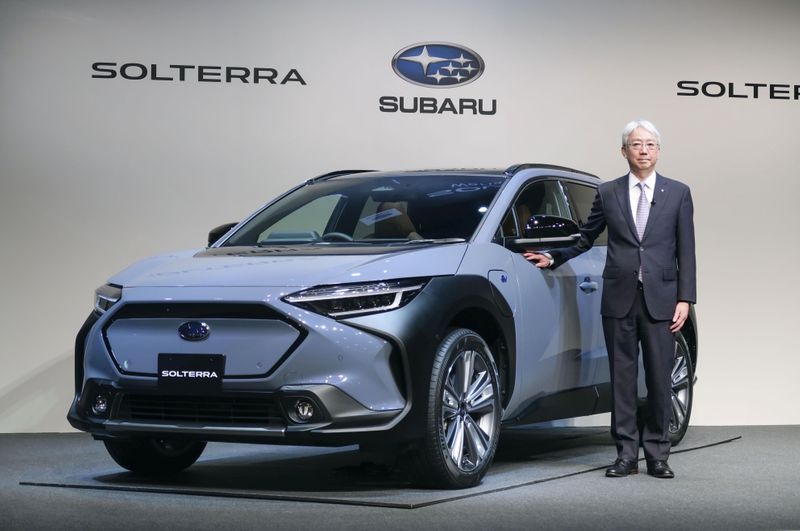 © Reuters. Subaru Corp. President and CEO Tomomi Nakamura stands next to the first all-electric vehicle (EV) Solterra during an unveiling event in Tokyo, Japan November 11, 2021, in this photo taken by Kyodo. Mandatory credit Kyodo/via REUTERS