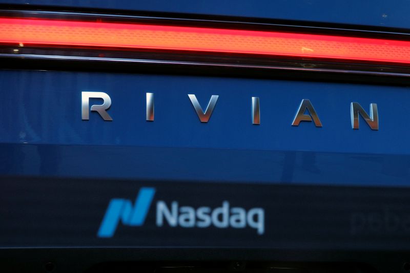 &copy; Reuters. The company logo is seen on a Rivian R1T pickup, the Amazon-backed electric vehicle (EV) maker, as it is parked outside the Nasdaq Market site during the company’s IPO in Times Square in New York City, U.S., November 10, 2021. REUTERS/Brendan McDermid