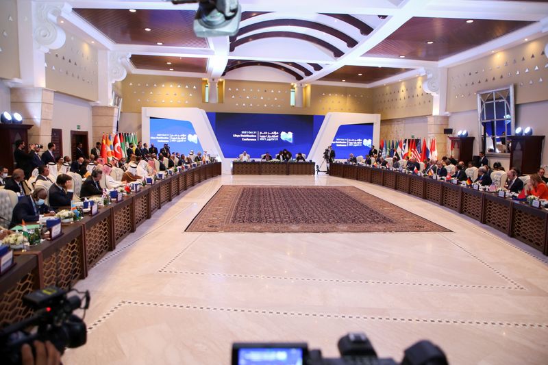 © Reuters. FILE PHOTO: Delegates take part in an international conference to support the stability of Libya ahead of the country's presidential elections in December, in Tripoli, Libya, October 21, 2021. REUTERS/Hazem Ahmed