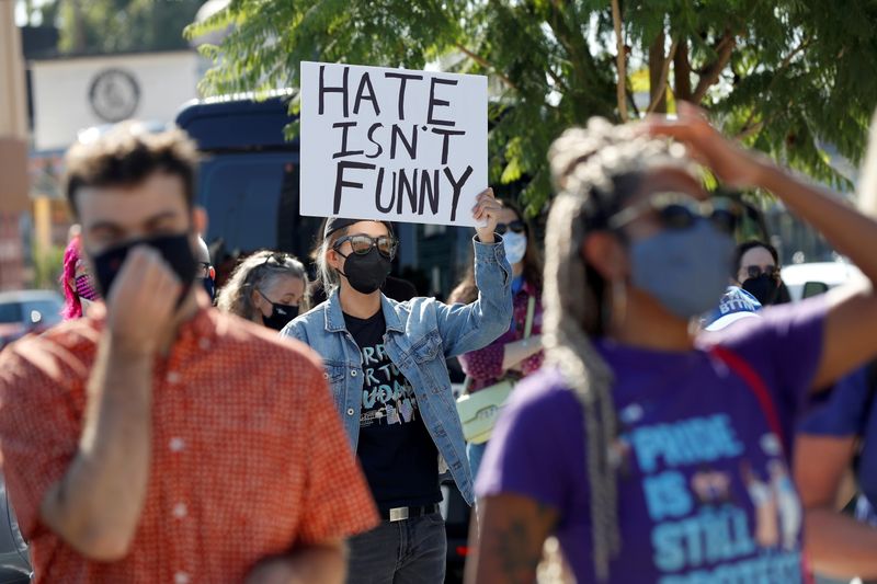 &copy; Reuters. FILE PHOTO: People attend a rally in support of the Netflix transgender employee walkout 'Stand Up in Solidarity' to protest the streaming of comedian Dave Chappelle's new comedy special, in Los Angeles, California, U.S. October 20 2021. REUTERS/Mario Anz