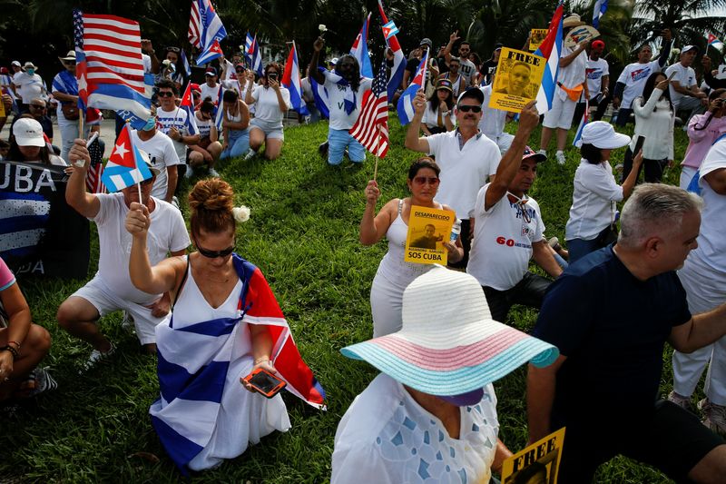 &copy; Reuters. People attend a rally ahead of an opposition demonstration in Cuba, in Miami, Florida, U.S. November 14, 2021. REUTERS/Marco Bello
