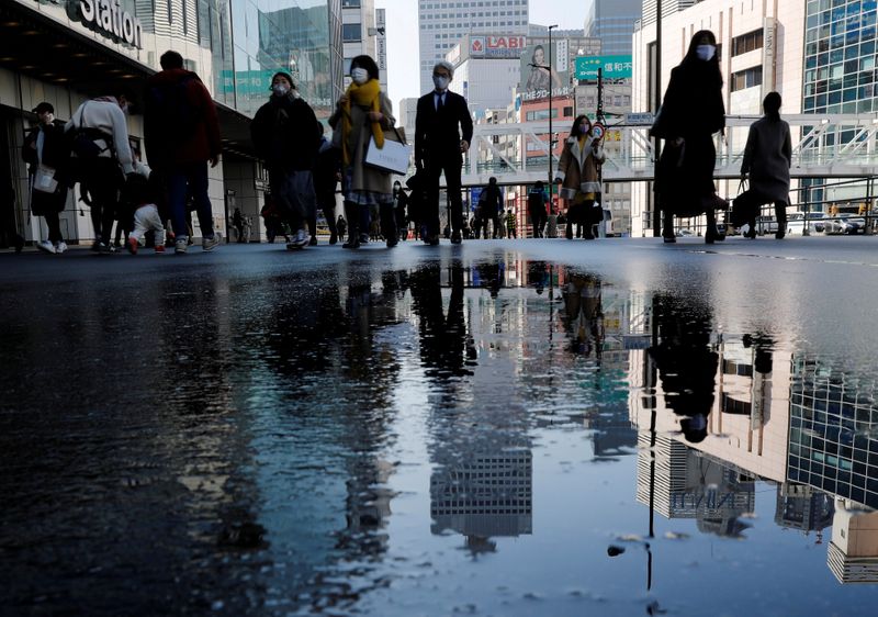 Japan's economy shrinks more than expected as supply shortages hit