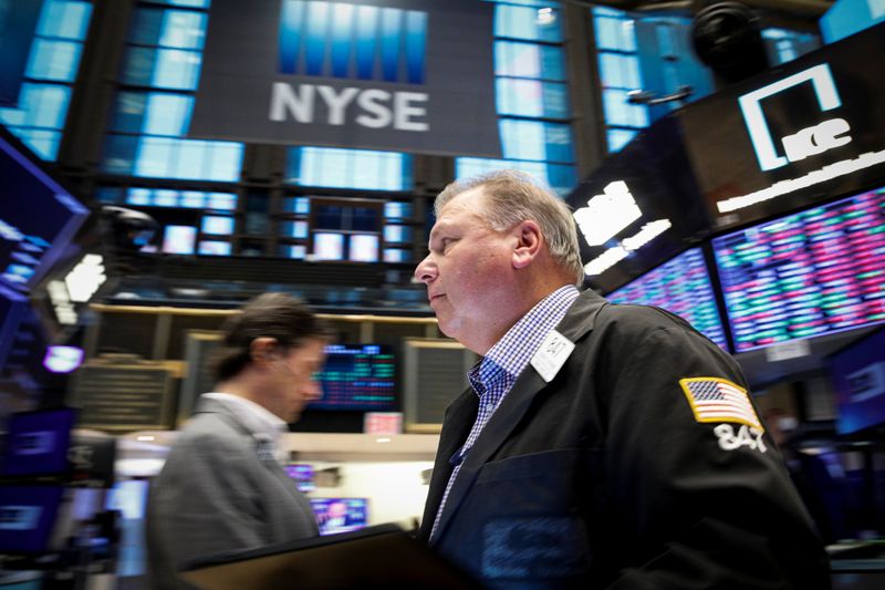 &copy; Reuters. FILE PHOTO: Traders work on the floor of the New York Stock Exchange (NYSE) in New York City, U.S., October 27, 2021.  REUTERS/Brendan McDermid