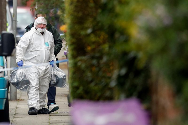© Reuters. A member of forensic police looks on as he walks, following the car blast of Liverpool Women's Hospital, in Liverpool, Britain, November 15, 2021. REUTERS/Ed Sykes