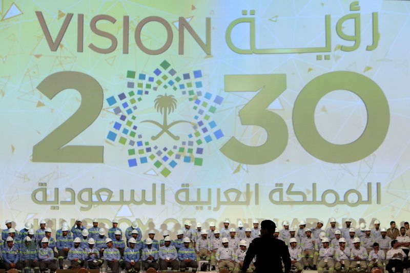 &copy; Reuters. FILE PHOTO: A large banner shows Saudi Vision for 2030 as a soldier stands guard before the arrival of Saudi King Salman at the inauguration of several energy projects in Ras Al Khair, Saudi Arabia, November 29, 2016.  REUTERS/Zuhair Al-Traifi