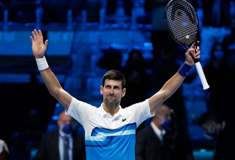 &copy; Reuters. Novak Djokovic comemora após vencer na estreia do ATP Finals em Turim
15/11/2021 REUTERS/Guglielmo Mangiapane