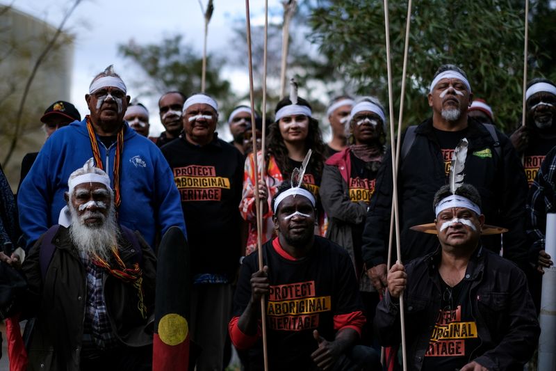 © Reuters. FILE PHOTO: Aboriginal groups' members take part in a protest against what they say is a lack of detail and consultation on new heritage protection laws, after the Rio Tinto mining group destroyed ancient rock shelters for an iron ore mine last year, in Perth, Australia August 19, 2021. Courtesy Gabrielle Timmins/Kimberley Land Council/Handout via REUTERS