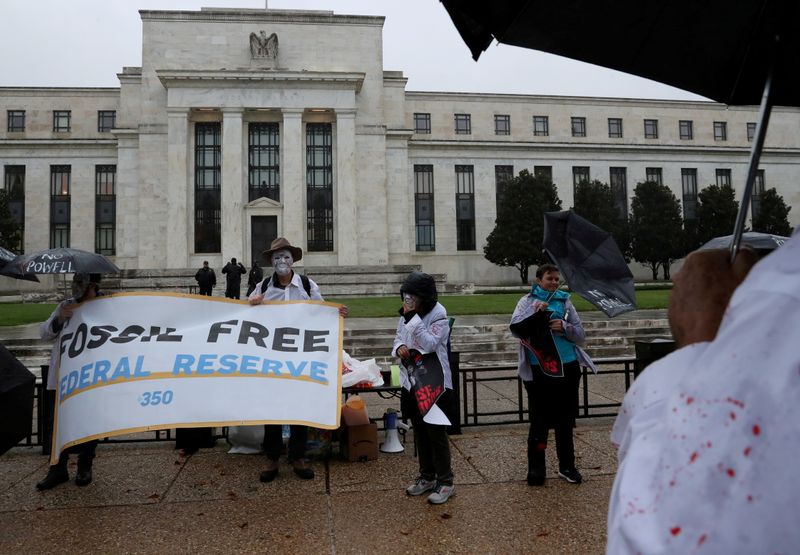 &copy; Reuters. FILE PHOTO: Climate change activists voice their opposition to U.S. President Joe Biden reappointing Jerome Powell to serve a second four-year term as the chairman of the Federal Reserve and demand Biden appoint a climate advocate, during a rally outside 