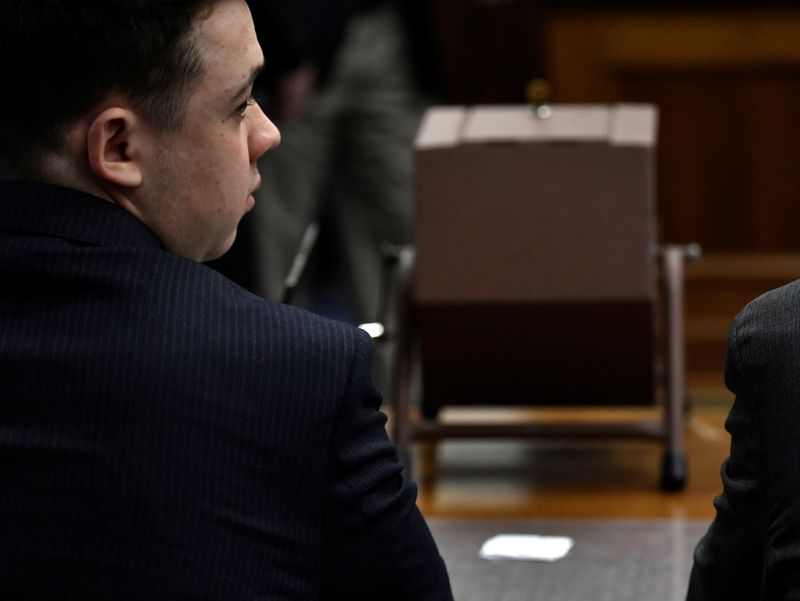 &copy; Reuters. FILE PHOTO: Kyle Rittenhouse sits next to the tumbler that he will use to select the jurors who will not participate in deliberations during his trial at the Kenosha County Courthouse in Kenosha, Wisconsin, U.S., November 16, 2021. Sean Krajacic/Pool via 