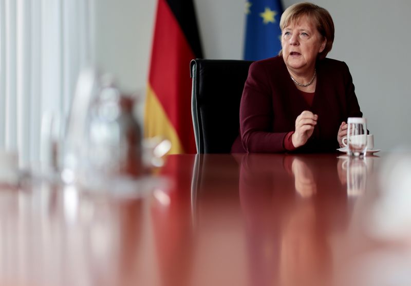 &copy; Reuters. FILE PHOTO: German Chancellor Angela Merkel attends a Reuters interview at the Chancellery in Berlin, Germany, November 11, 2021. REUTERS/Hannibal Hanschke