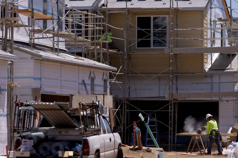 &copy; Reuters. FILE PHOTO: Residential single family homes construction by KB Home are shown under construction in the community of Valley Center, California, U.S. June 3, 2021.   REUTERS/Mike Blake