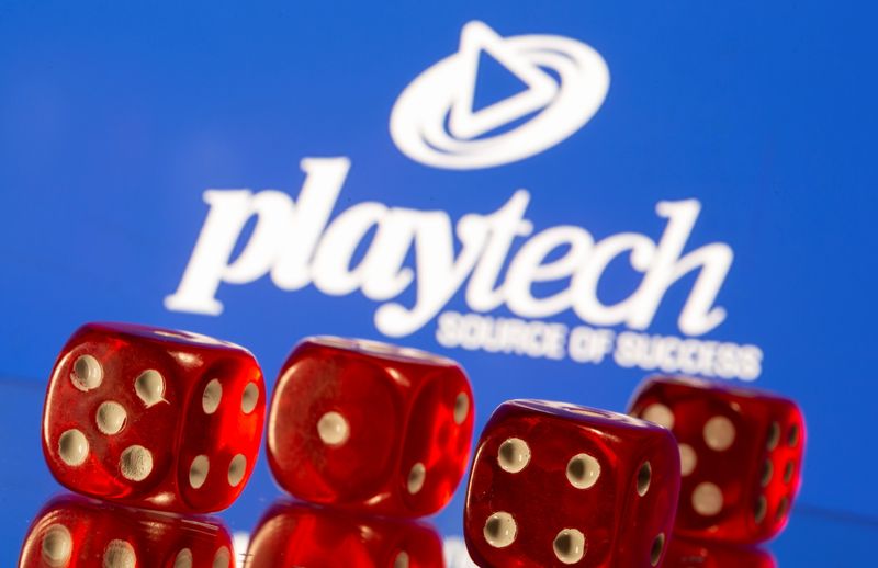 &copy; Reuters. Gambling cubes are seen in front of displayed Playtech logo in this illustration taken, November 8, 2021. REUTERS/Dado Ruvic/Illustration