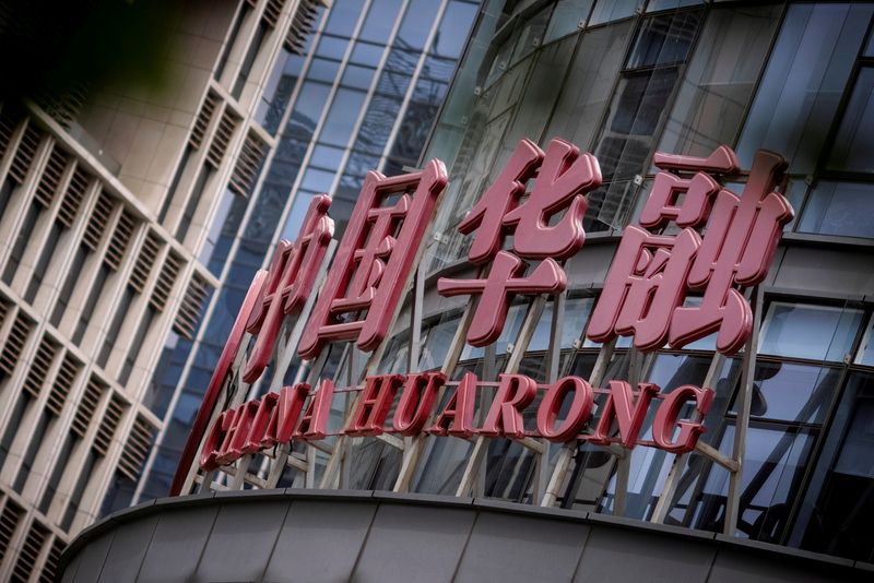 &copy; Reuters. FILE PHOTO: The logo of China Huarong Asset Management Co is seen at its office in Beijing, China, April 16, 2021. REUTERS/Thomas Peter/File Photo