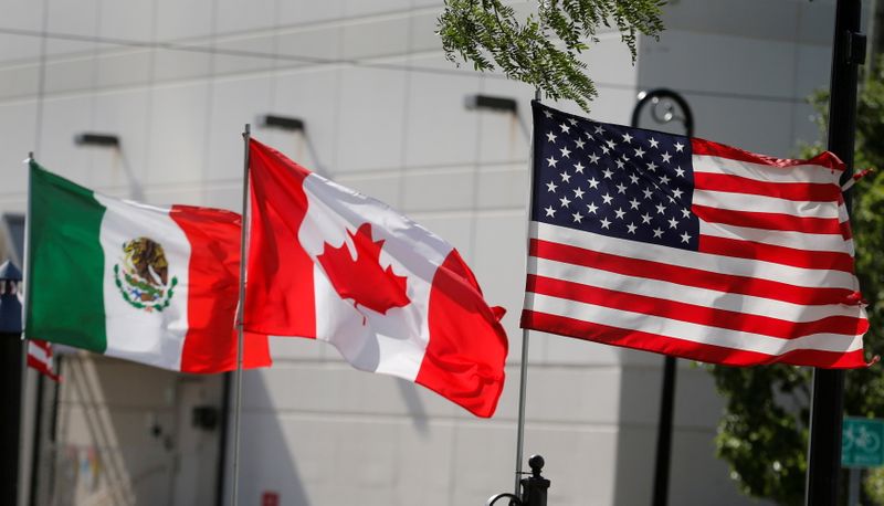 &copy; Reuters. FILE PHOTO: Flags of the U.S., Canada and Mexico fly next to each other in Detroit, Michigan, U.S. August 29, 2018.  REUTERS/Rebecca Cook/File Photo