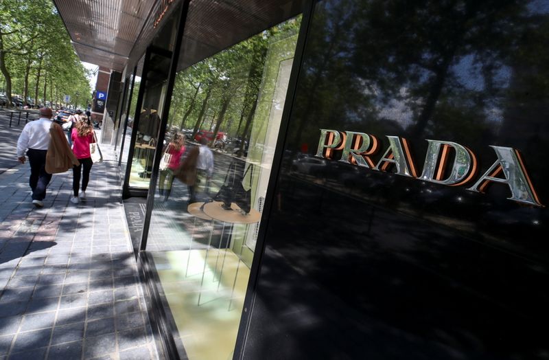 &copy; Reuters. FILE PHOTO: A logo of luxury goods company Prada is seen at the entrance of a shop in Brussels, Belgium July 2, 2021. REUTERS/Yves Herman
