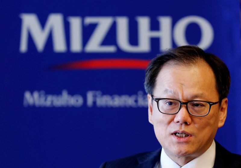 © Reuters. FILE PHOTO: Mizuho Financial Group's Chief Executive Officer Tatsufumi Sakai attends an interview with Reuters at the company's headquarters in Tokyo, Japan August 20, 2018. Picture taken August 20, 2018.  REUTERS/Toru Hanai