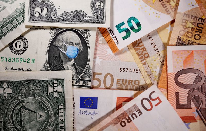 &copy; Reuters. FILE PHOTO: George Washington is seen with printed medical masks on the one Dollar near Euro banknotes in this illustration  taken, March 31, 2020. REUTERS/Dado Ruvic/Illustration