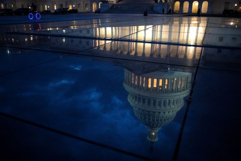 © Reuters. A bicyclist rides along the East Front Plaza at the U.S. Capitol in Washington, U.S., November 18, 2021. REUTERS/Tom Brenner