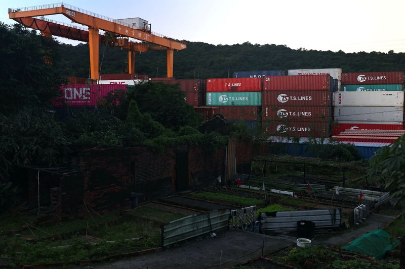 &copy; Reuters. Cargo cranes are seen moving containers at a container yard in Keelung, Taiwan, November 18, 2020. REUTERS/Ann Wang