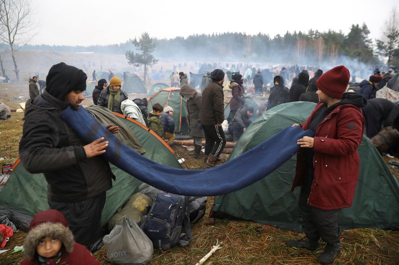 Poland says Belarus ferries migrants back to border after clearing camps