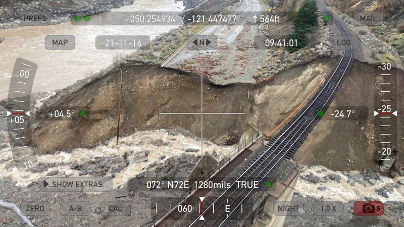 &copy; Reuters. Railway tracks are suspended above the washed out Tank Hill underpass of the Trans Canada Highway 1 during a survey flight after devastating rain storms caused flooding and landslides, noertheast of Lytton, British Columbia, Canada November 16, 2021. Pict