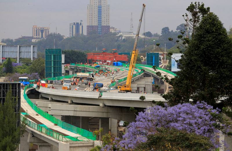 &copy; Reuters. Workers are seen on site during the construction of the Nairobi Expressway, undertaken by the China Road and Bridge Corporation (CRBC) on a public-private partnership (PPP) basis, along Uhuru Highway in Nairobi, Kenya October 20, 2021. Picture taken Octob