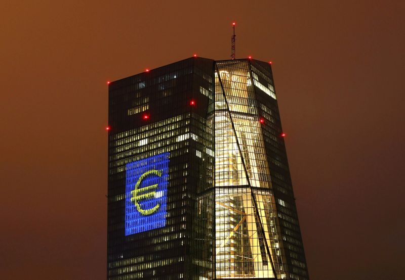 &copy; Reuters. FILE PHOTO: The headquarters of the European Central Bank (ECB) is illuminated with a giant euro sign at the start of the "Luminale, light and building" event in Frankfurt, Germany, March 12, 2016.     REUTERS/Kai Pfaffenbach/File Photo