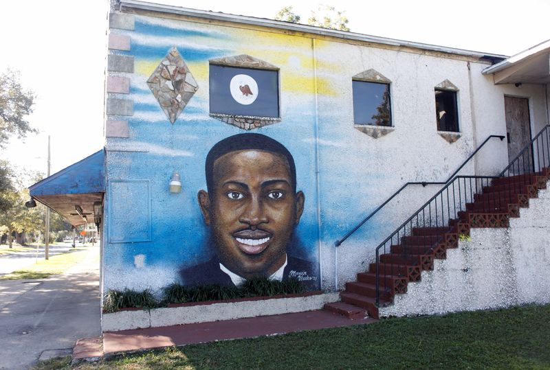 &copy; Reuters. FILE PHOTO: A mural of Ahmaud Arbery is painted on the side of The Brunswick African American Cultural Center in downtown Brunswick, Georgia, U.S. October 19, 2021. REUTERS/Octavio Jones/File Photo