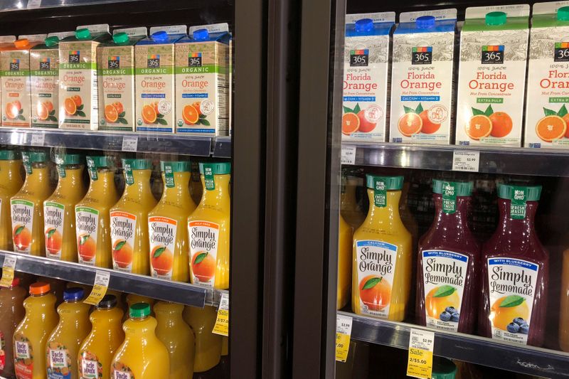 &copy; Reuters. Coca-Cola Co's Simply Orange is displayed next to Whole Foods' private label 365 Everyday Value orange juice in a Whole Foods Market store in Venice, California, U.S., March 17, 2018.  REUTERS/Lisa Baertlein