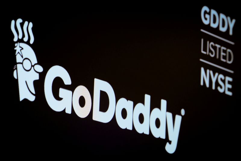 &copy; Reuters. FILE PHOTO: The company logo and ticker for GoDaddy Inc. is displayed on a screen on the floor of the New York Stock Exchange (NYSE) in New York, U.S., March 4, 2019. REUTERS/Brendan McDermid