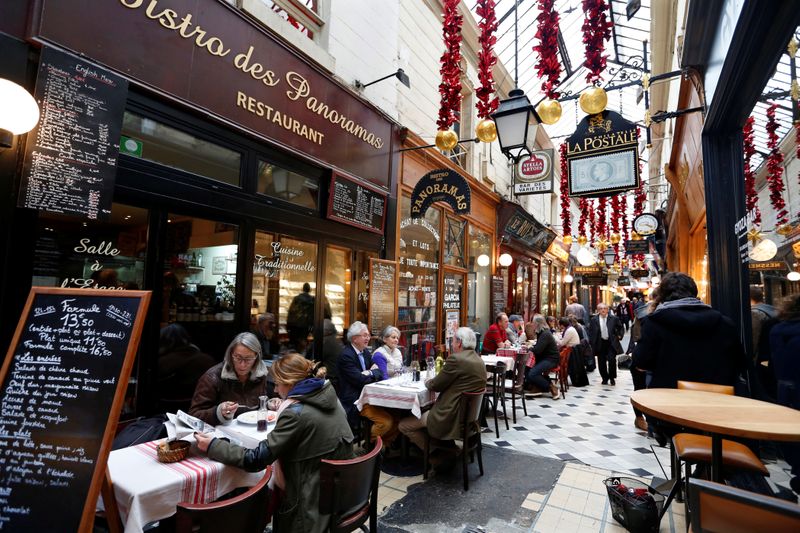 &copy; Reuters. FILE PHOTO: People sit at tables as they have lunch outside bistros in a covered passageway, the Passage des Panoramas, in Paris, France, November 17, 2015.   REUTERS/Charles Platiau/File Photo  