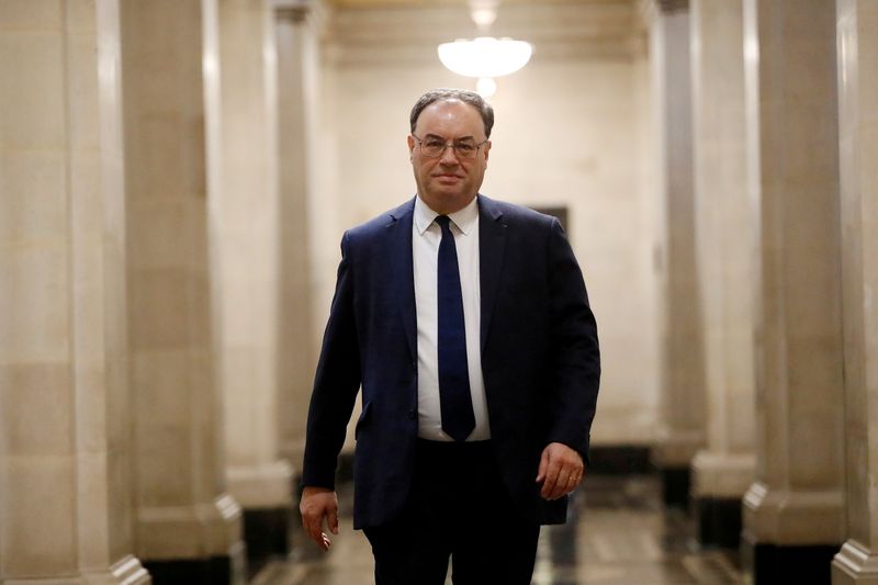 &copy; Reuters. FILE PHOTO: Bank of England Governor Andrew Bailey poses for a photograph on the first day of his new role at the Central Bank in London, Britain March 16, 2020. Tolga Akmen/Pool via REUTERS