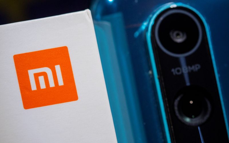 &copy; Reuters. Xiaomi logo is seen next to a smartphone of the same brand in this illustration taken September 28, 2021. REUTERS/Dado Ruvic/Illustration