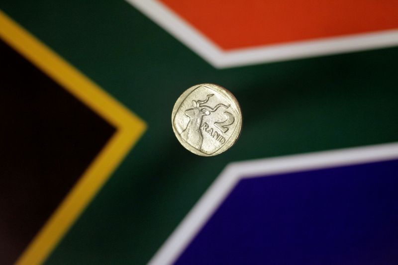 &copy; Reuters. Illustration photo shows a two-rand coin above a South African flag April 12, 2017.   REUTERS/Thomas White/Illustration