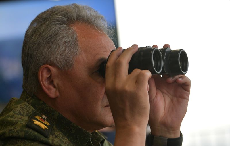 &copy; Reuters. Russian Defence Minister Sergei Shoigu uses a pair of binoculars while observing the military exercises "Zapad-2021" staged by the armed forces of Russia and Belarus at the Mulino training ground in Nizhny Novgorod Region, Russia, September 13, 2021. Sput