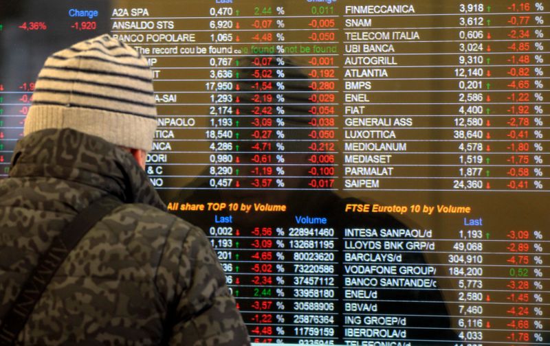 &copy; Reuters. A man looks at financial information on a screen outside a bank in downtown Milan March 18, 2013. Italian and Spanish yields jumped on Monday while German yields hit 2013 lows, with investors viewing the euro zone's push for a levy on Cypriot bank savings
