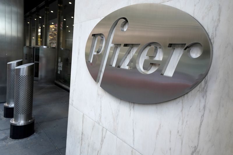 &copy; Reuters. FILE PHOTO: The Pfizer logo is pictured on their headquarters building in the Manhattan borough of New York City, New York, U.S., November 9, 2020. REUTERS/Carlo Allegri