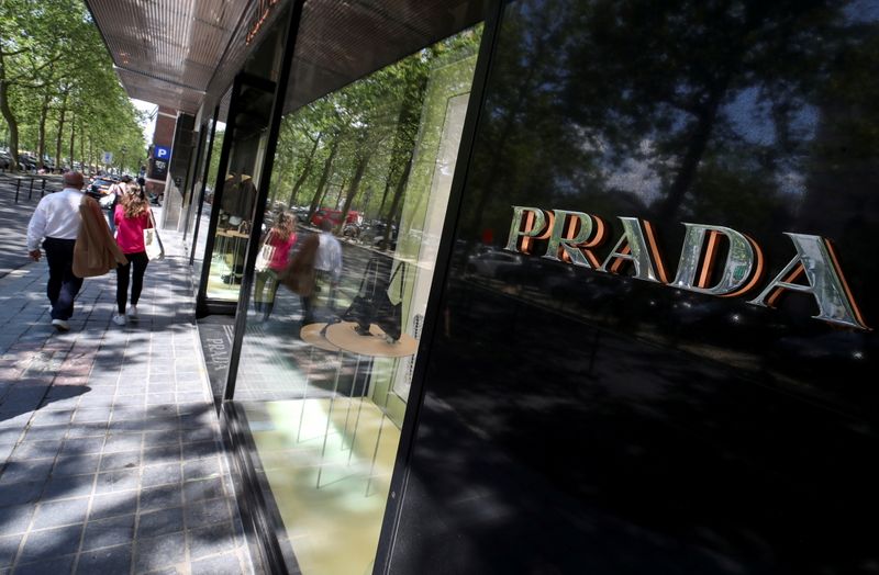 &copy; Reuters. FILE PHOTO: A logo of luxury goods company Prada is seen at the entrance of a shop in Brussels, Belgium July 2, 2021. REUTERS/Yves Herman