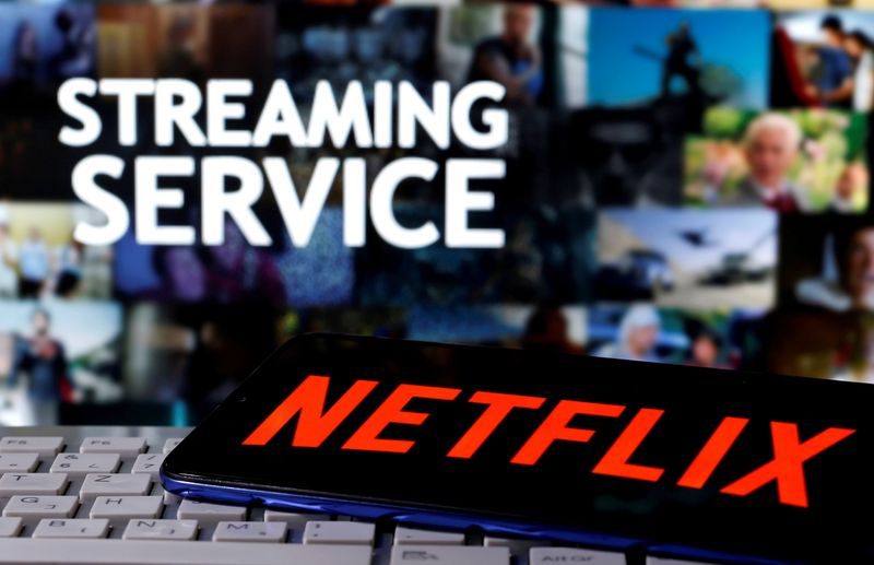 &copy; Reuters. FILE PHOTO: A smartphone with the Netflix logo is seen on a keyboard in front of displayed "Streaming service" words in this illustration taken March 24, 2020. REUTERS/Dado Ruvic/File Photo/File Photo