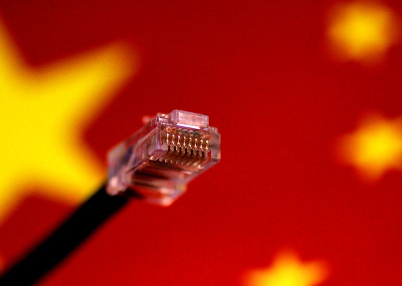 &copy; Reuters. FILE PHOTO: A computer network cable is seen above a Chinese flag in this July 12, 2017 illustration photo.   REUTERS/Thomas White/Illustration