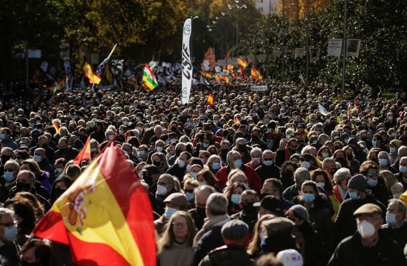 &copy; Reuters. People attend a protest against the proposed changes to anti-terrorism and gagging laws, which police officers say will undermine their authority and jeopardise the safety of citizens, in Madrid, Spain, November 27, 2021. REUTERS/Javier Barbancho
