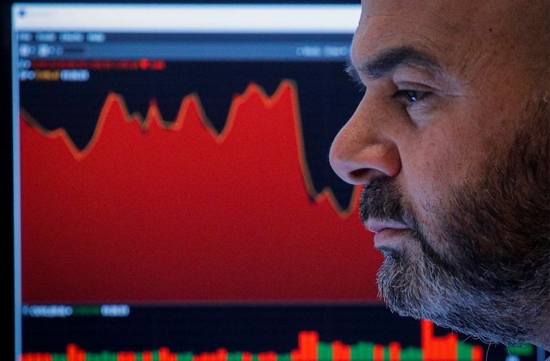 &copy; Reuters. A trader works in his booth on the floor of the New York Stock Exchange (NYSE) in New York City, U.S., November 26, 2021.  REUTERS/Brendan McDermid