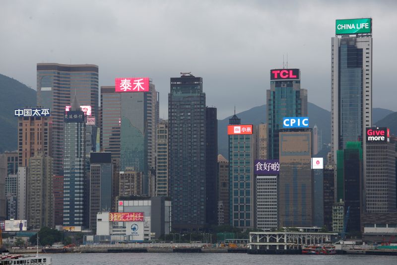 &copy; Reuters. Neon signs illuminate China's listed companies including China Life Insurance, TCL Corporation, China Pacific Insurance Company (CPIC), Xiaomi Inc (Mi), Beijing Enterprises Holdings (bottom), Bank of Communications (2nd L) and China Taiping Insurance Hold