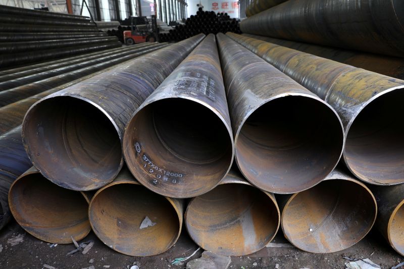 &copy; Reuters. FILE PHOTO: Steel pipes are seen stacked at an industrial park in Shenyang, Liaoning province, China September 30, 2021. REUTERS/Tingshu Wang/File Photo