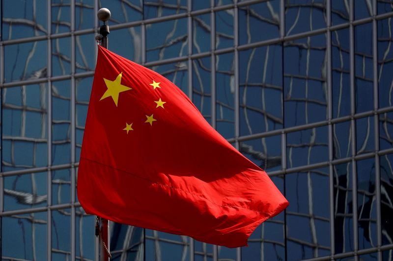 &copy; Reuters. FILE PHOTO: The Chinese national flag is seen in Beijing, China April 29, 2020. REUTERS/Thomas Peter/File Photo