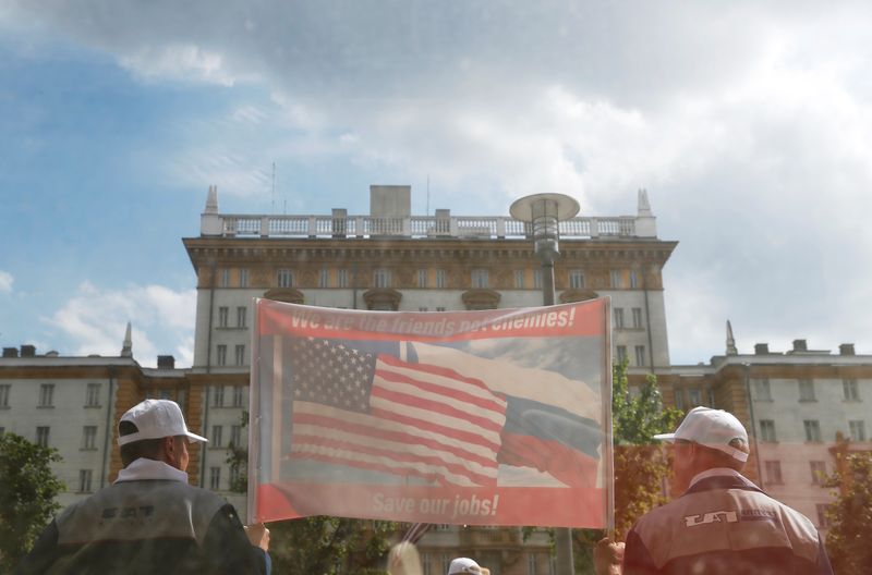 &copy; Reuters. Workers of Gorkovsky Automobile Plant (GAZ) attend a rally in front of the U.S. Embassy in Moscow, Russia June 10, 2019. REUTERS/Maxim Shemetov