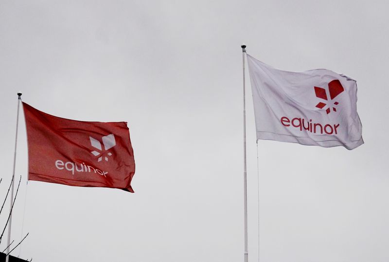 &copy; Reuters. FILE PHOTO: Equinor's flags flutter next to the company's headqurters in Stavanger, Norway December 5, 2019. REUTERS/Ints Kalnins/File Photo